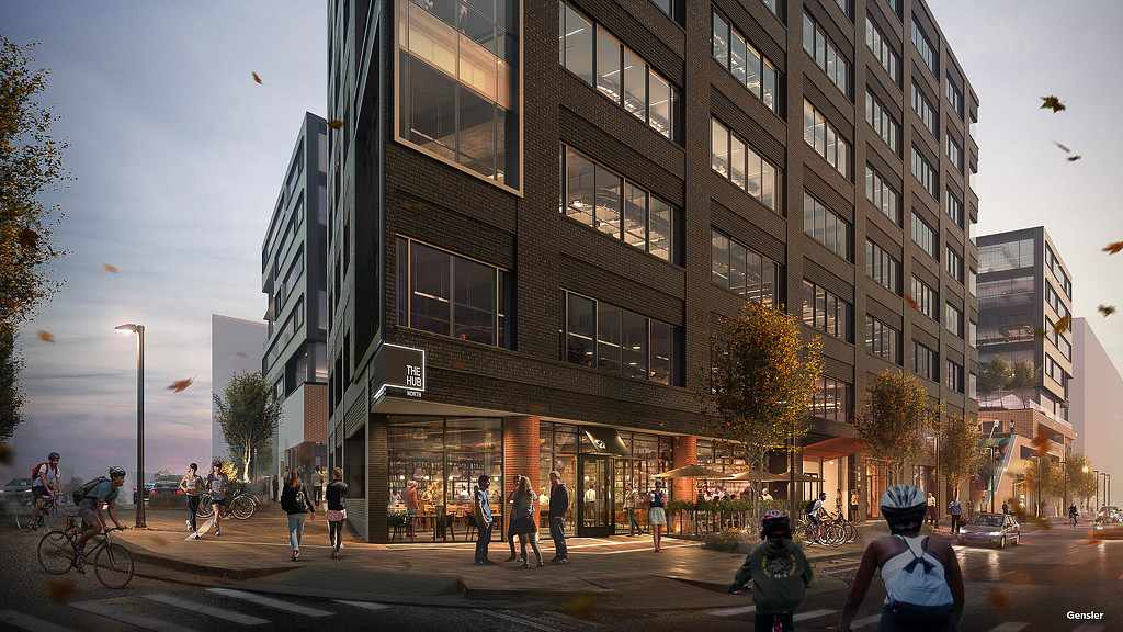 A group of people walking around a building.